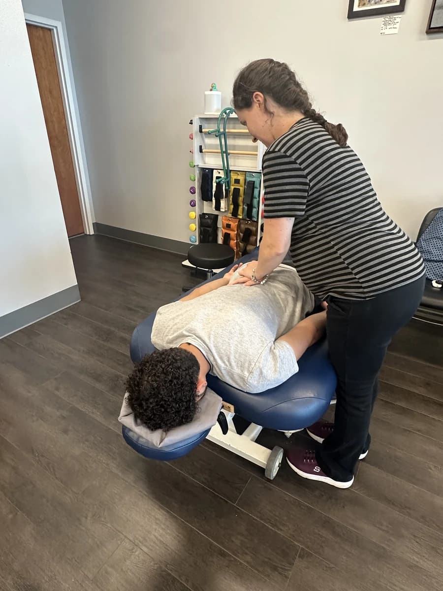 Hands-on back treatment in a Fusion clinic.