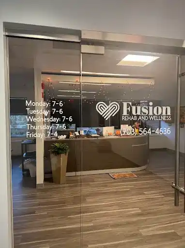 Glass entrance door with Fusion lettering at the Reston clinic